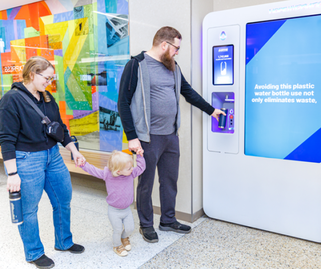 Family using water refill station.