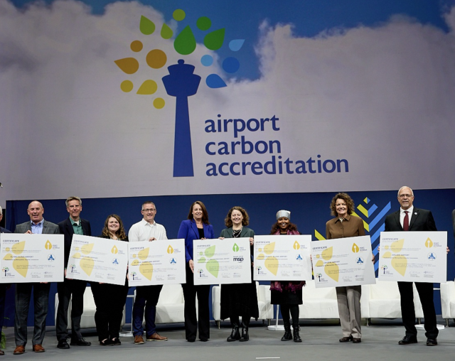 MAC representatives accepting airport carbon accreditation.